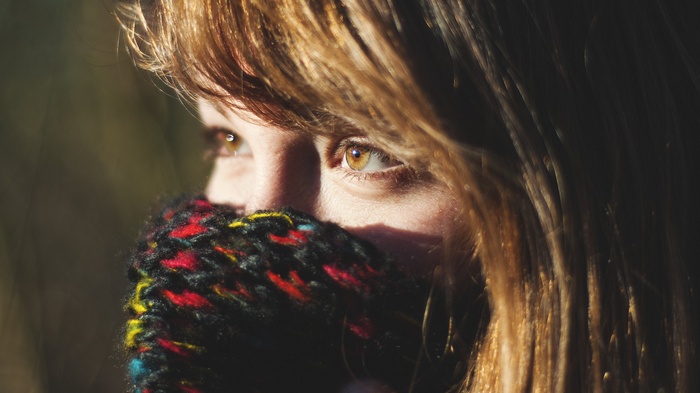 Woman with brown eyes and scarf