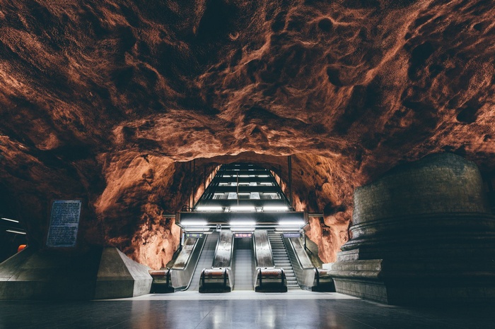Stockholm Subway Station with Rock Formations and Escalators