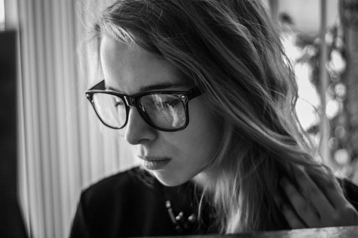 Woman wearing glasses, monochrome portrait