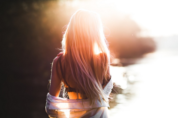 Woman with blonde hair in sunlight