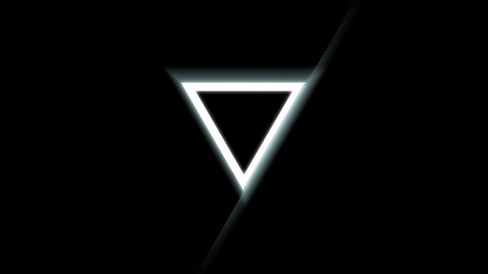 Glowing white triangle on black background