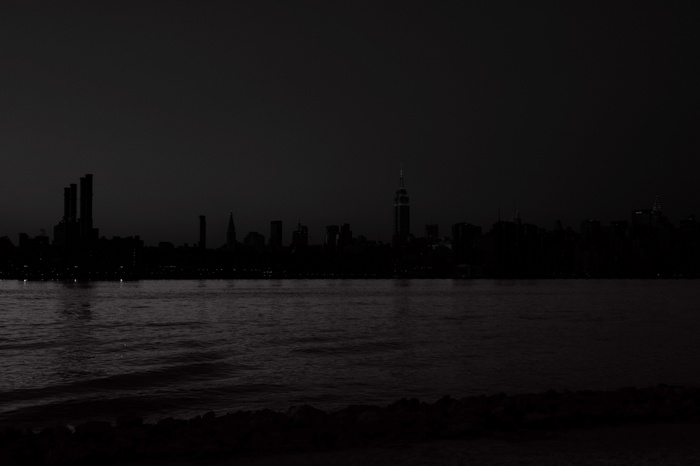 New York City skyline at night over the water