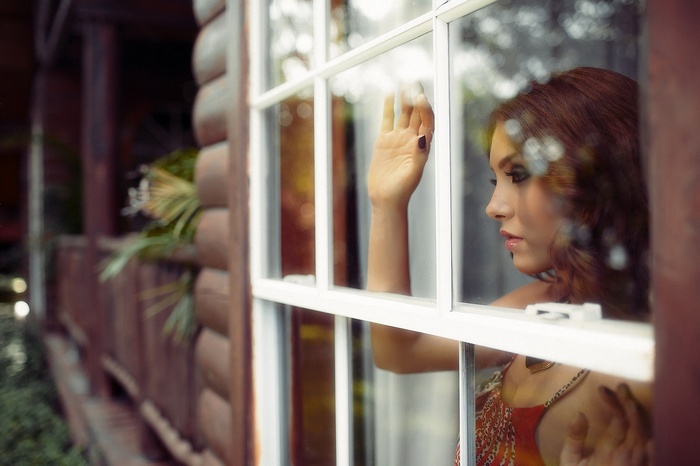 Woman looking out a window