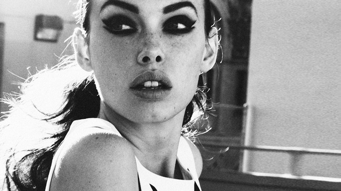 Monochrome portrait of a woman with freckles