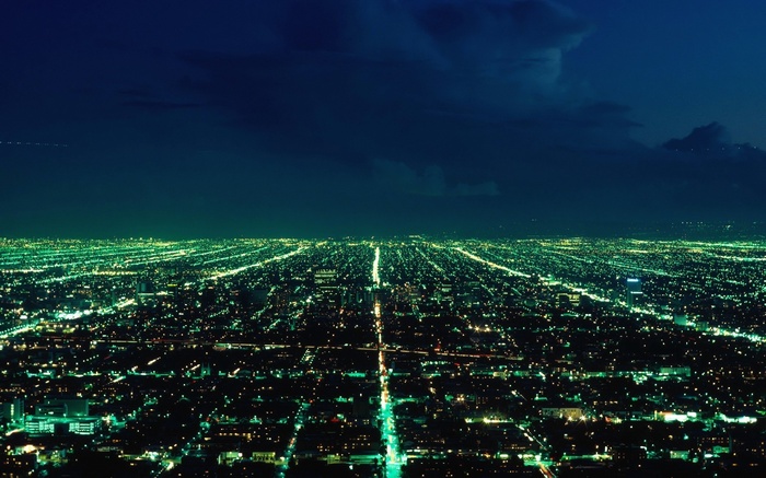 Aerial view of a sprawling city at night