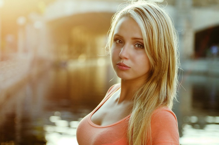 Woman with blonde hair looking at viewer