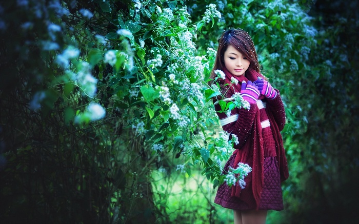 Asian model in a burgundy dress and scarf