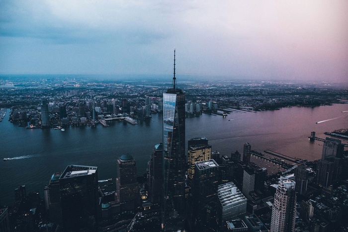 One World Trade Center and New York City skyline at dusk