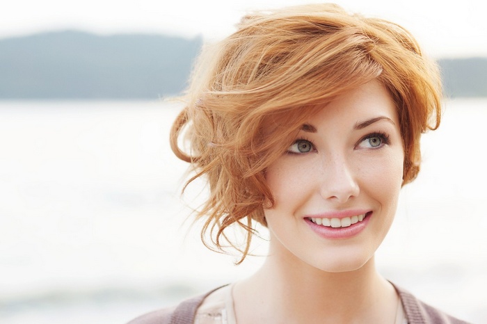 Mara Kerr with short red hair and blue eyes