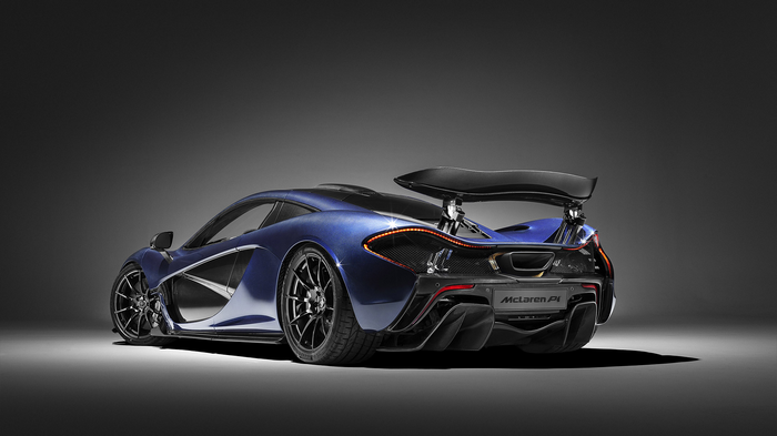 Blue McLaren P1 sports car with large rear wing