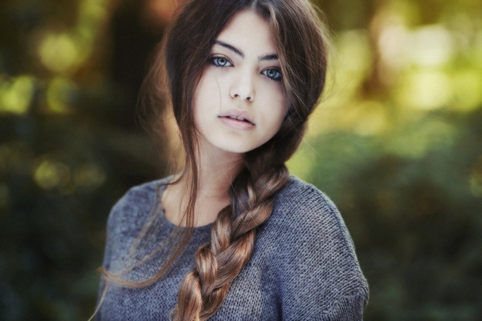 Woman with braided hair and blue eyes