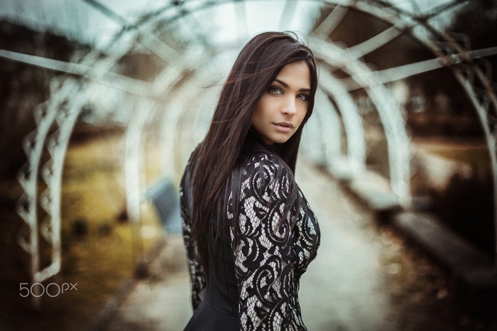 Woman in black dress looking at viewer