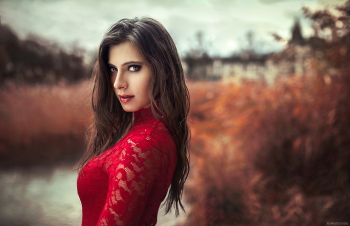 Woman in red lace dress outdoors