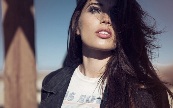 Woman with dark hair and denim jacket