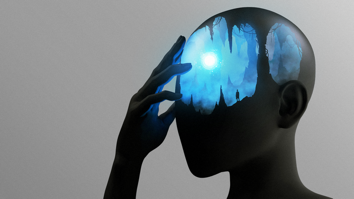 Silhouette of a head with a fantasy cave inside