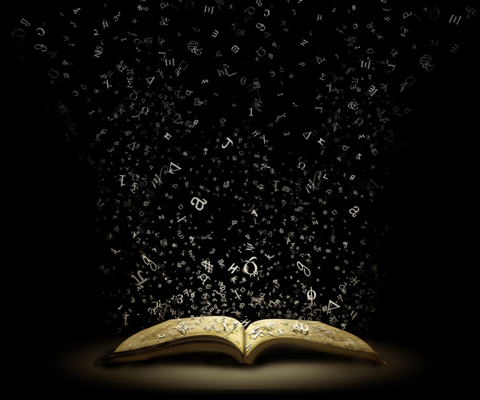 An open book with letters flying out