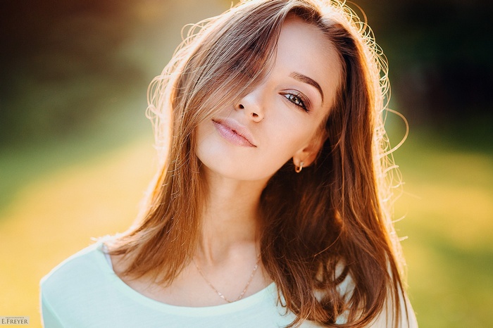 Portrait of a young woman with hazel eyes and brunette hair