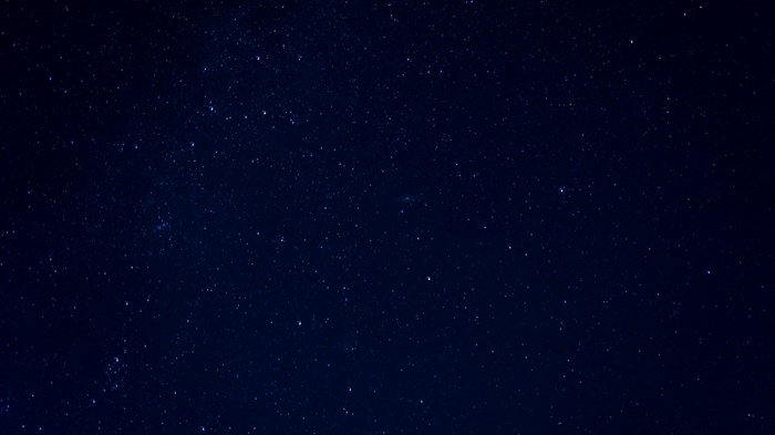 A dark blue night sky filled with countless stars