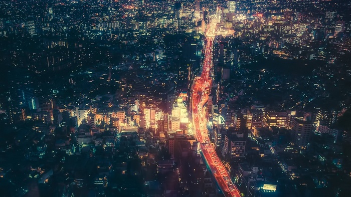 Aerial view of Tokyo at night with traffic