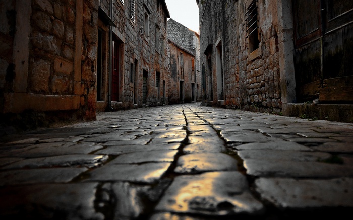 Cobblestone street in Croatia with stone buildings