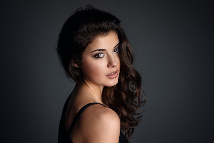 Portrait of a woman with dark wavy hair