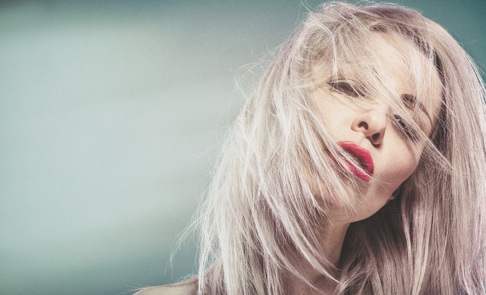 Portrait of a blonde woman with red lipstick