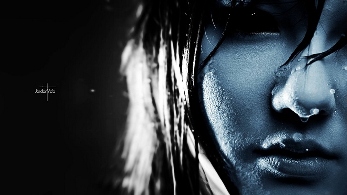 Close-up of a person's face with water droplets