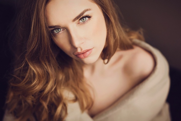 Woman with auburn hair and green eyes