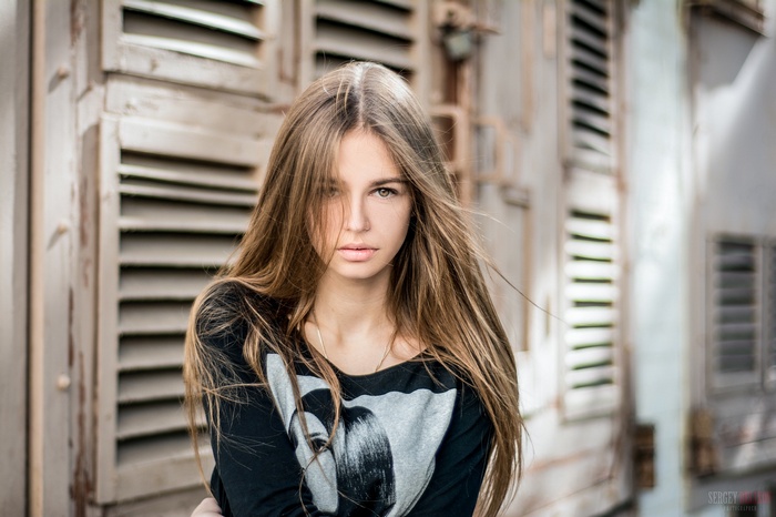 Portrait of a young woman with long blonde hair