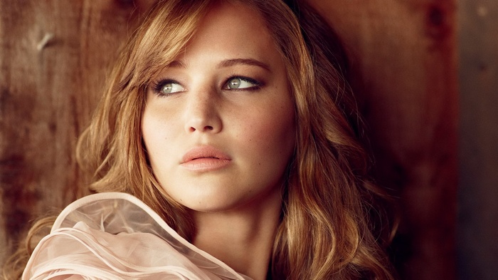 Jennifer Lawrence with blonde hair and green eyes