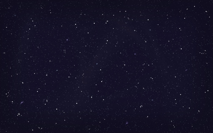 A dark night sky filled with countless stars