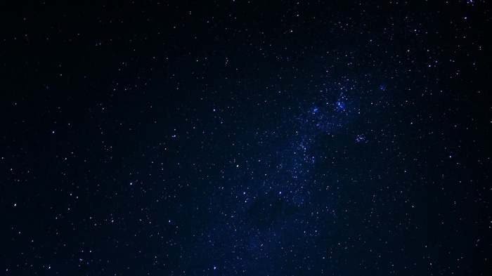 A dark night sky filled with countless stars