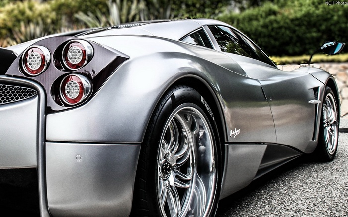 Silver Pagani Huayra sports car rear view