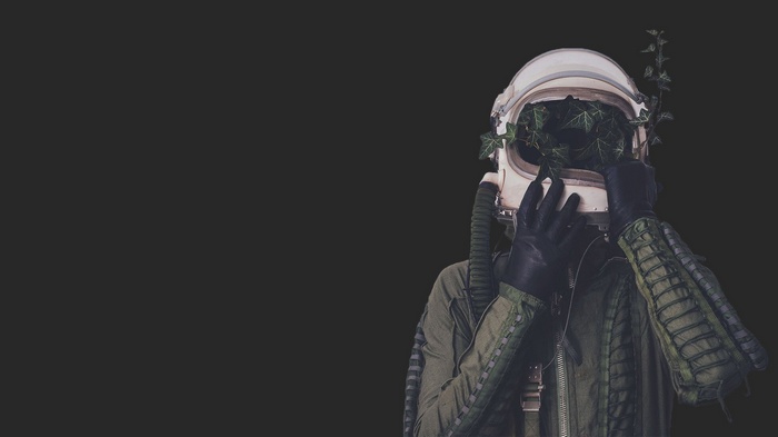 Astronaut helmet with plants and ivy