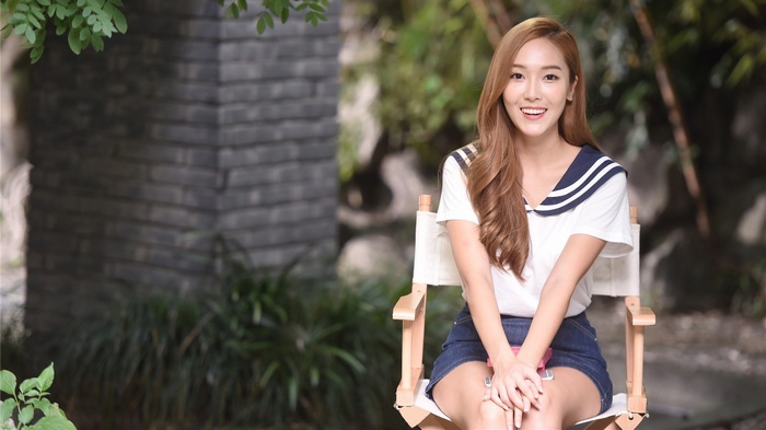 Jessica Jung sitting in a chair outdoors