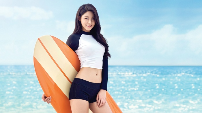 Seolhyun with a surfboard on the beach