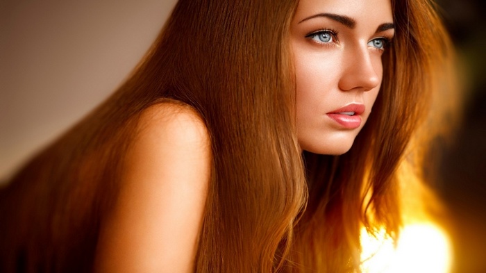 Marina Isayeva with long red hair and blue eyes