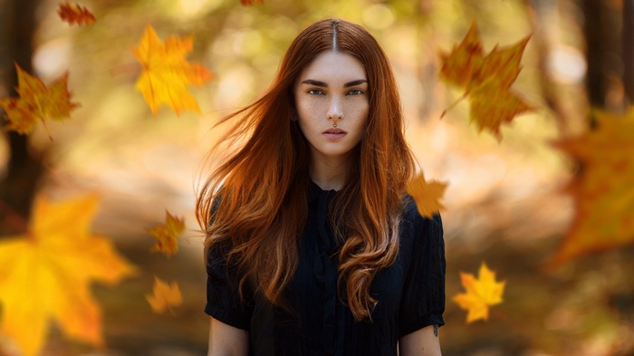 Redhead woman with freckles in fall
