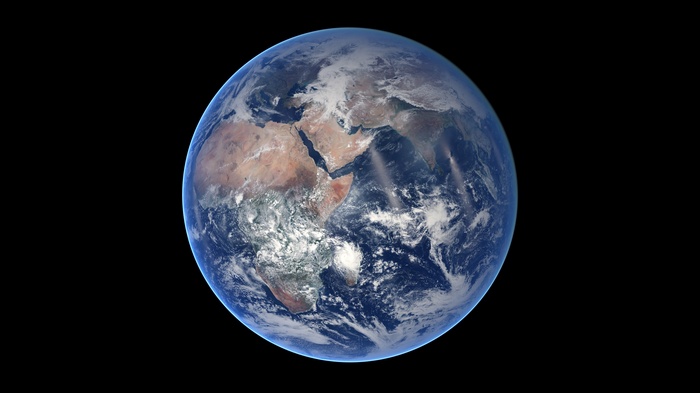Earth seen from space with clouds and land masses