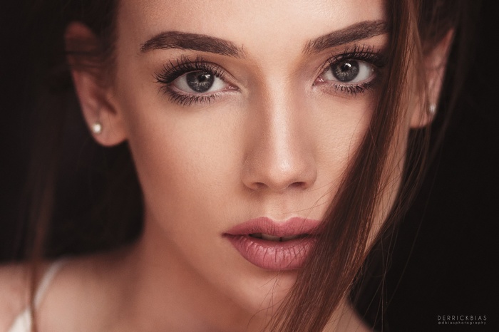 Close-up portrait of a woman with dark hair
