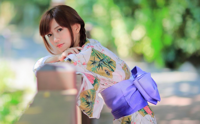 Woman in a traditional Japanese kimono with braided hair