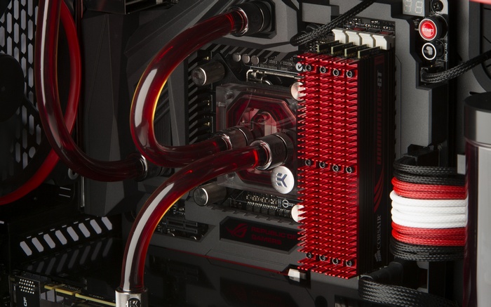 Custom PC build with red liquid cooling and ASUS ROG motherboard