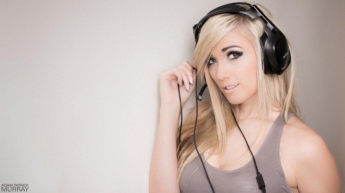 Lindsay Elyse wearing headsets and a tank top