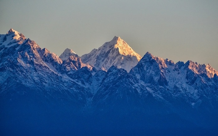 Snowy peaks of the Himalayas bathed in sunlight
