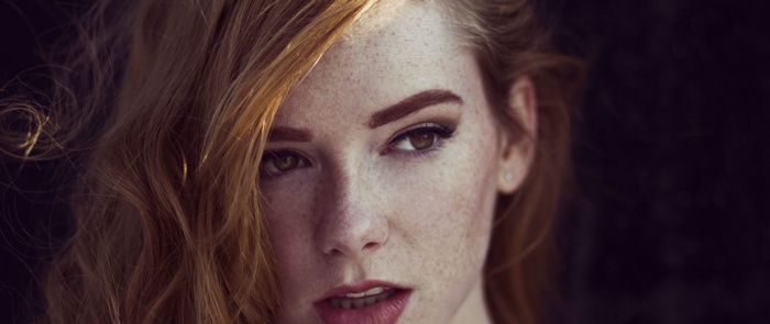 Close-up portrait of Hattie Watson with freckles