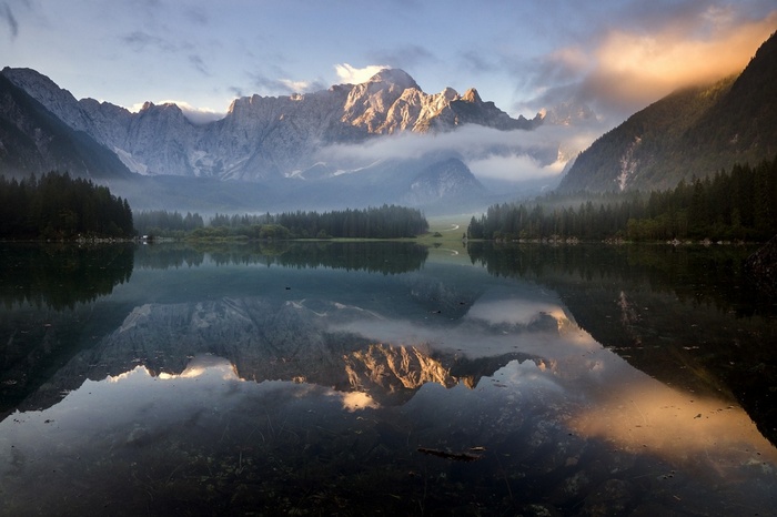 Mountains reflected in a lake in Italy