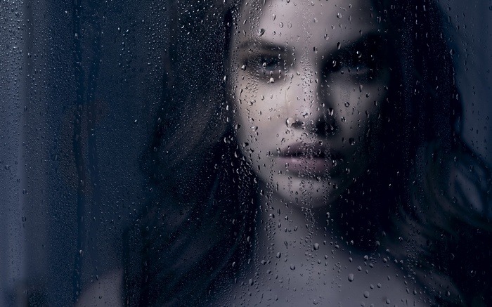 Barbara Palvin behind a wet glass pane