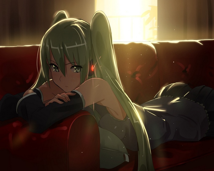Hatsune Miku lying on a red couch