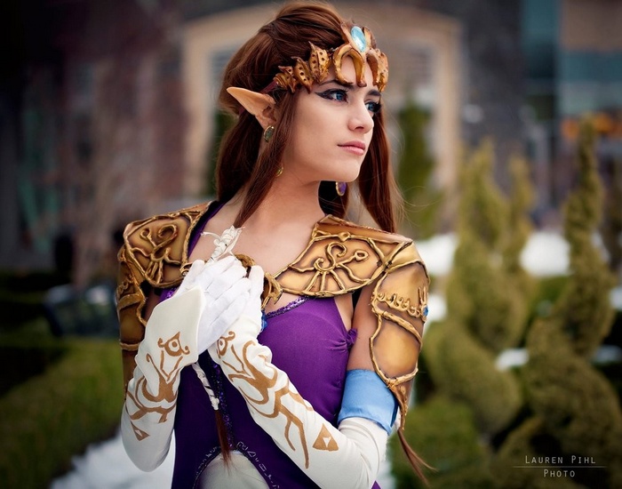Princess Zelda cosplay with ornate armor and gloves