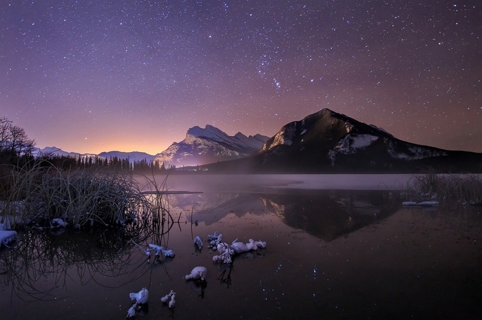 Starry Night Over Mountains and Lake in Banff National Park
